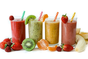 Four different smoothies of berry, banana with tangerine, kiwi, strawberries.