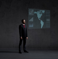 Businessman standing over futuristic map background. Business, technology, future, globalization concept.