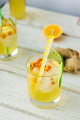 Fresh Ginger lemonade over white wooden background
