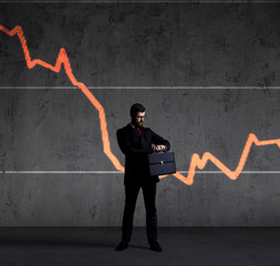 Businessman with briefcase standing over column diagram background. Business, crisis, default concept.