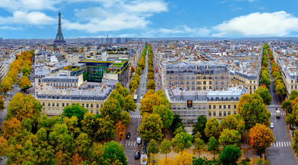 Paris, France - Eiffel Tower cityscape. Panorama from the Arc de Triomphe. Blue sky with clouds in autumn