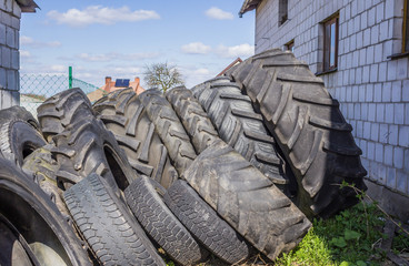Old rubber tires from  combine harvesters  . Dairy farm in Podlasie, Poland.