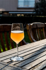 Bellini Cocktail made with peach in wine glass at garden
