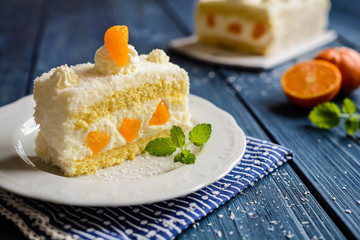 Coconut whipped cream cake with tangerines