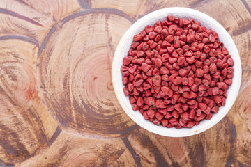 Seeds of achiote, originating from central america and parts of south america is used to season and color food