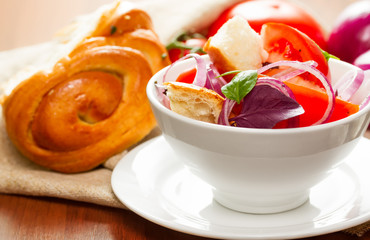 salad of tomatoes, red onions and dried bread - panzanella - Italian cuisine