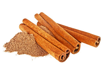 Cinnamon sticks and powder on a white background
