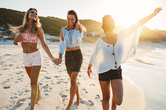 Group of beautiful young women enjoying on beach