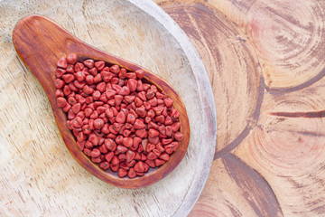 Seeds of achiote, originating from central america and parts of south america is used to season and color food