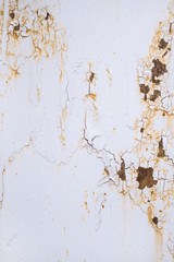 Detail of the old metal surface with with cracked paint, closeup
