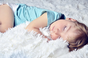 small child sleeps. Hands of the baby. pajamas