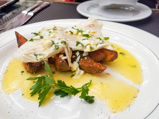 Fried Zander fish on roasted potatoes with Polish sauce