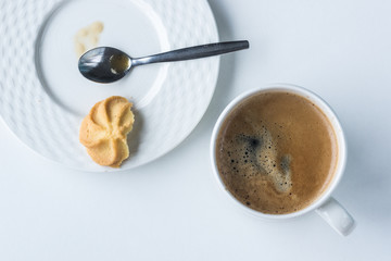 plate and coffe cup on wooden white background