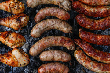Cook out. Sausages and chicken on grill