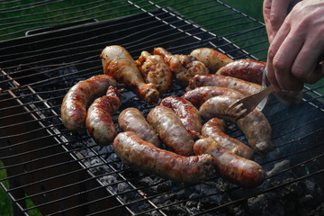 Cook out. Sausages and chicken on grill