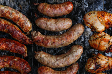 Cook out. Sausages and chicken on grill