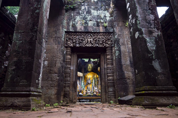 Buddha statue inside the sanctuary in Vat Phou (or Wat Phu) - Khmer Hindu temple complex in Champasak Province, southern Laos