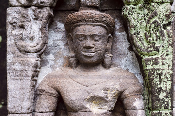 Fototapeta na wymiar Carved in stone sculptures on the facade of Vat Phou (or Wat Phu) - Khmer Hindu temple complex in Champasak Province, southern Laos