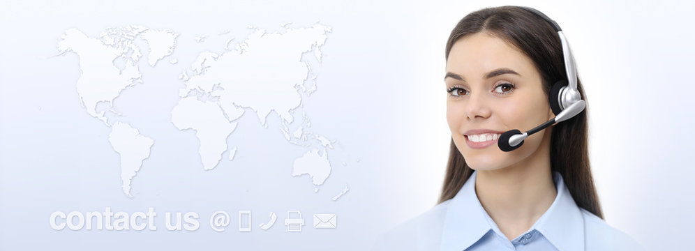 Customer service operator woman with headset smiling, world map on background, contact us concept