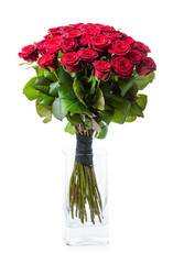 Obraz premium Bouquet of red roses in glass vase