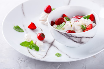 Eton Mess - Strawberries with whipped cream and meringue  Classic British summer dessert.selective focus