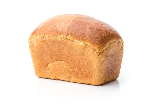 Loaf of wheat bread over white