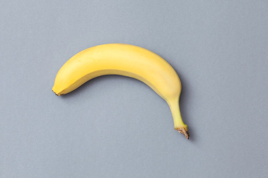ripe banana on a gray background