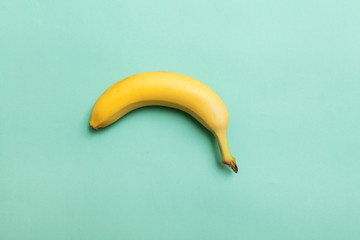 ripe banana on a background of mint color © sigma1850