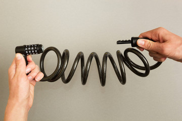 Bicycle lock with code on a gray background.