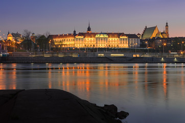 Old Town, Royal Castle at night in Warsaw, Poland. View from Vistula river.