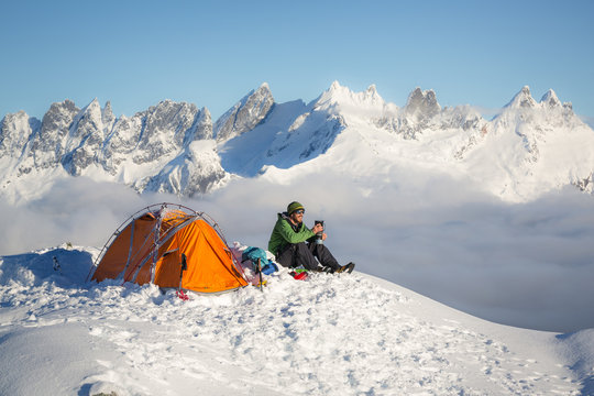 Man sat next to tent on Trappers Peak, Montana