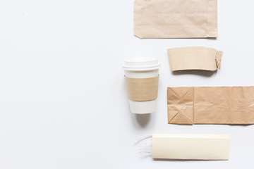 food delivery workdesk with paper bags and plastic cup table background top view mock-up