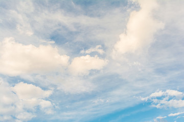 Blue sky with lots of different types of white clouds, abstract background