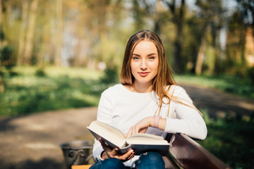 Young woman studying at the park