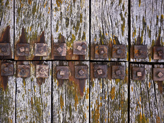 Old wood with rusty bolts