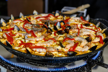 Cooking seafood paella typical spanish food.