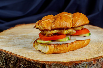 Grilled chicken sandwich with red onions