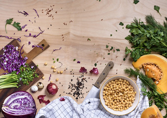 Clean vegetarian eating concept over natural wooden background, top view.