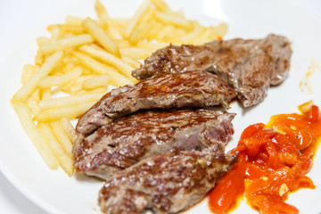 plate of beef steak with chips