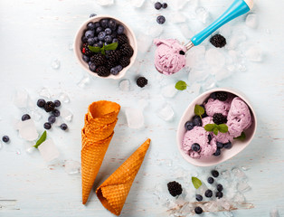 Ice cream of Berries,Blueberries,blackberries with mint in a  waffle cone.selective focus.