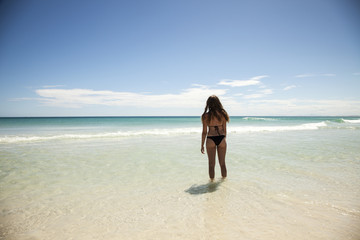 girl with black bikini on a beautiful beach