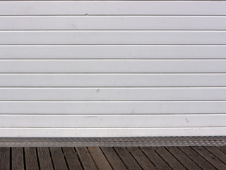 White wood panels on decking
