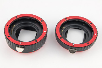 Set of macro rings for SLR cameras on a white background.