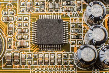 Microchip on the motherboard of the computer close macro.