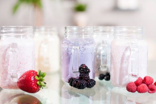 Refreshing milk smoothie with scattered berries