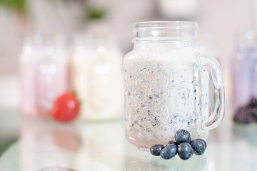Refreshing milk smoothie with scattered berries