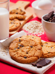 Round cookies with chocolate on the red table