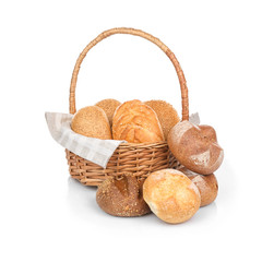 Wicker basket with fresh bread on white background