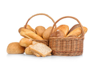 Wicker basket with fresh bread on white background