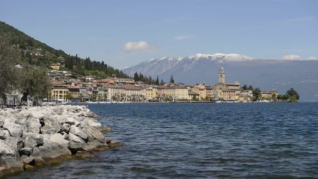 Landscape of the town of Sal&ograve;, on the shores of Lake Garda, with snowy mountains as a background